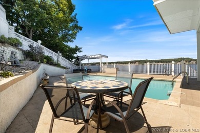 Perched above the shimmering waters of the Lake of the Ozarks - photo 46