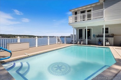 Perched above the shimmering waters of the Lake of the Ozarks - photo 47
