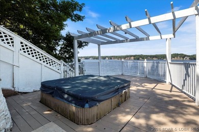 Perched above the shimmering waters of the Lake of the Ozarks - photo 49