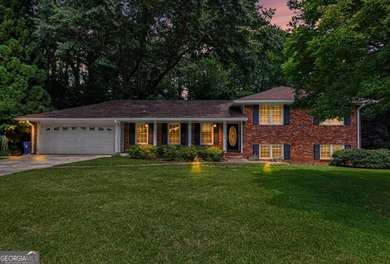 This charming split-level home with a rocking chair front porch - photo 2