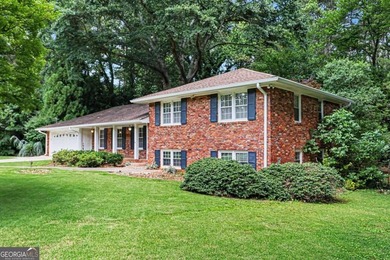 This charming split-level home with a rocking chair front porch - photo 3
