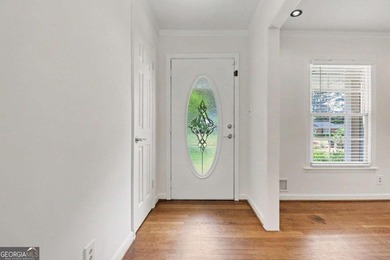 This charming split-level home with a rocking chair front porch - photo 4