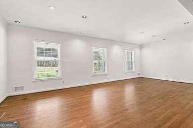 This charming split-level home with a rocking chair front porch - photo 8