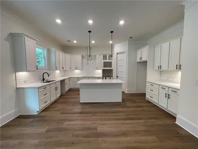 Stunning 2-story home with a 3rd car garage in a coveted