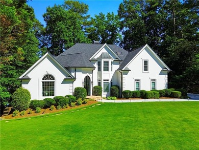 Nestled in a quiet cul-de-sac in the highly desirable, upscale - photo 1