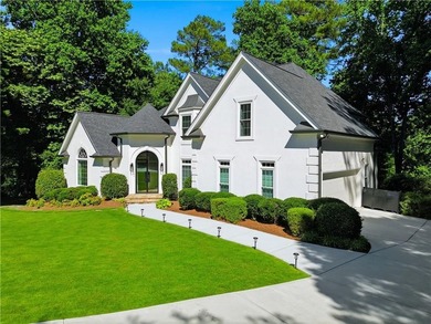 Nestled in a quiet cul-de-sac in the highly desirable, upscale - photo 4