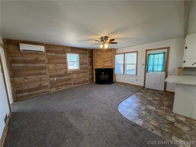 Cute as a button! This cozy cabin is perfectly positioned on a