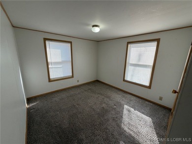 Cute as a button! This cozy cabin is perfectly positioned on a