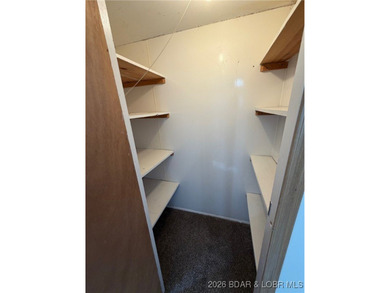 Cute as a button! This cozy cabin is perfectly positioned on a