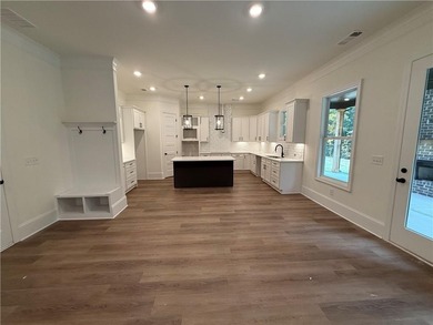 Stunning 2-story home with a 3rd car garage in a coveted