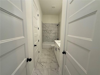 Stunning 2-story home with a 3rd car garage in a coveted