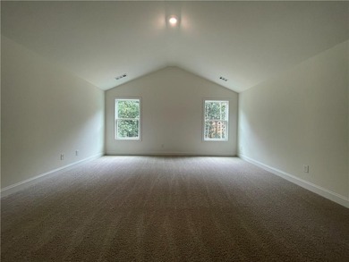 Stunning 2-story home with a 3rd car garage in a coveted