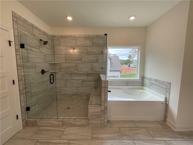 Stunning 2-story home with a 3rd car garage in a coveted