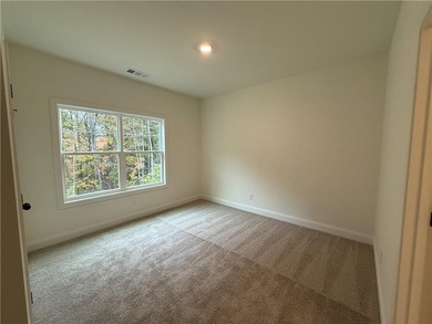 Stunning 2-story home with a 3rd car garage in a coveted