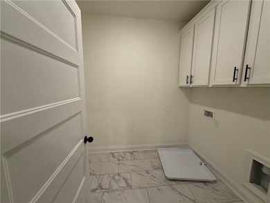 Stunning 2-story home with a 3rd car garage in a coveted