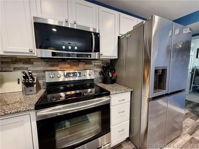 Lake life just got a serious glow-up! This beautifully remodeled - photo 11