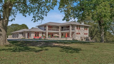 Set on 26 scenic acres, this stunning modern prairie-style home - photo 45