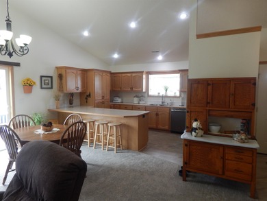 Easy living in this one level home in quiet 55+ community.This