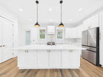 Discover coastal charm and modern luxury in this stunning Point - photo 18