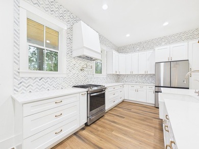 Discover coastal charm and modern luxury in this stunning Point - photo 19
