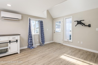 Welcome to this charming chalet style home offering 2 bedrooms