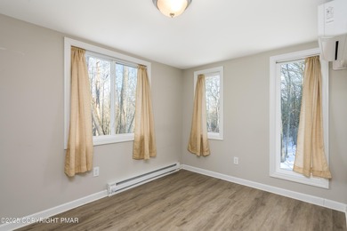 Welcome to this charming chalet style home offering 2 bedrooms