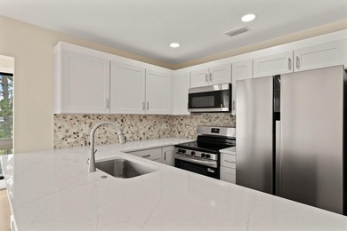 Lake front! This freshly updated condo offers a comfortable and - photo 11