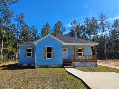 Lake Home For Sale in Carriere, Mississippi