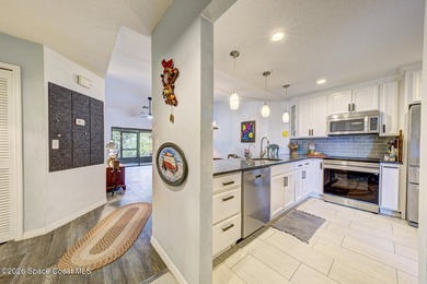 This end-unit townhome is located in desirable Satellite Beach - photo 3