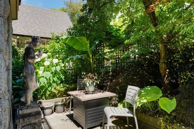 Tucked away behind your own private fenced garden oasis, this - photo 12
