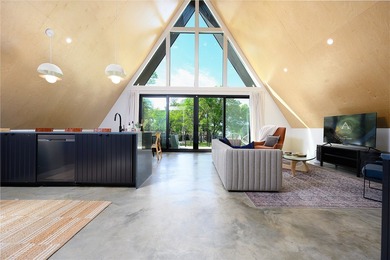 Elevated open water views pair with lake access at this A-frame - photo 8