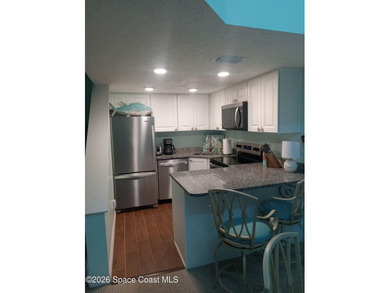 PARADISE! This lovely turnkey unit boasts an AC unit replaced - photo 4