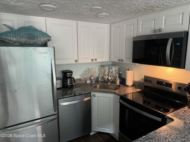 PARADISE! This lovely turnkey unit boasts an AC unit replaced - photo 5