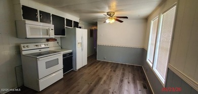 What a price! This 3BR/2BA has lots of potential to shine again - photo 3