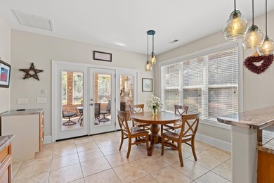 Nestled in a beautiful lakefront setting, this all-brick - photo 12