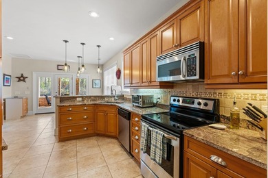 Nestled in a beautiful lakefront setting, this all-brick - photo 13