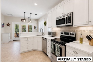 Nestled in a beautiful lakefront setting, this all-brick - photo 14
