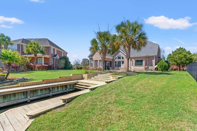 Nestled in a beautiful lakefront setting, this all-brick - photo 49