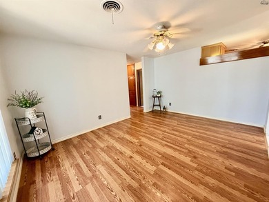 Charming 3-bedroom, 1.5-bath home with Pergo wood and tile - photo 3