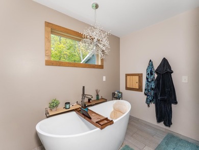 Enjoy this 3 bdrm. 3.5 bath lakefront single story home with - photo 15