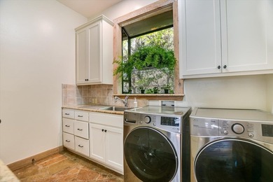Beyond a gated entrance and beneath a canopy of mature live oaks - photo 23