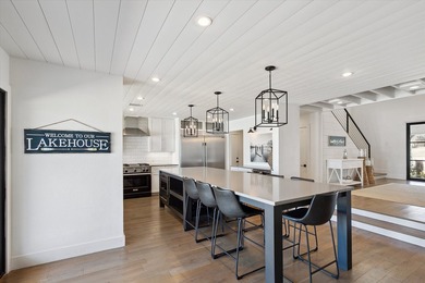 Exceptional waterfront home with contemporary design set against - photo 11