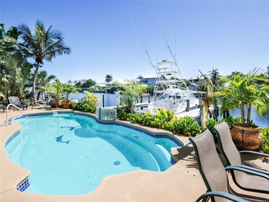 A rare waterfront estate along a 200-foot wide canal with a - photo 14