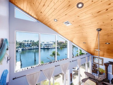 A rare waterfront estate along a 200-foot wide canal with a - photo 17