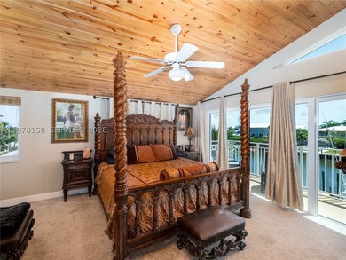 A rare waterfront estate along a 200-foot wide canal with a - photo 20