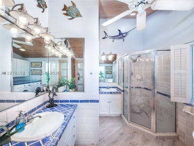 A rare waterfront estate along a 200-foot wide canal with a - photo 21
