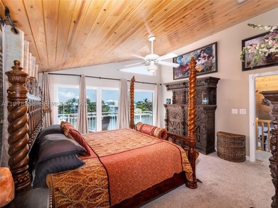A rare waterfront estate along a 200-foot wide canal with a - photo 22