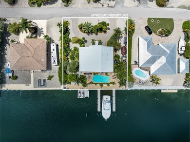 A rare waterfront estate along a 200-foot wide canal with a - photo 29