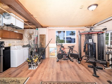 A rare waterfront estate along a 200-foot wide canal with a - photo 34