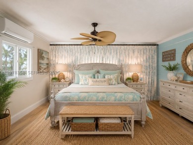 A rare waterfront estate along a 200-foot wide canal with a - photo 39